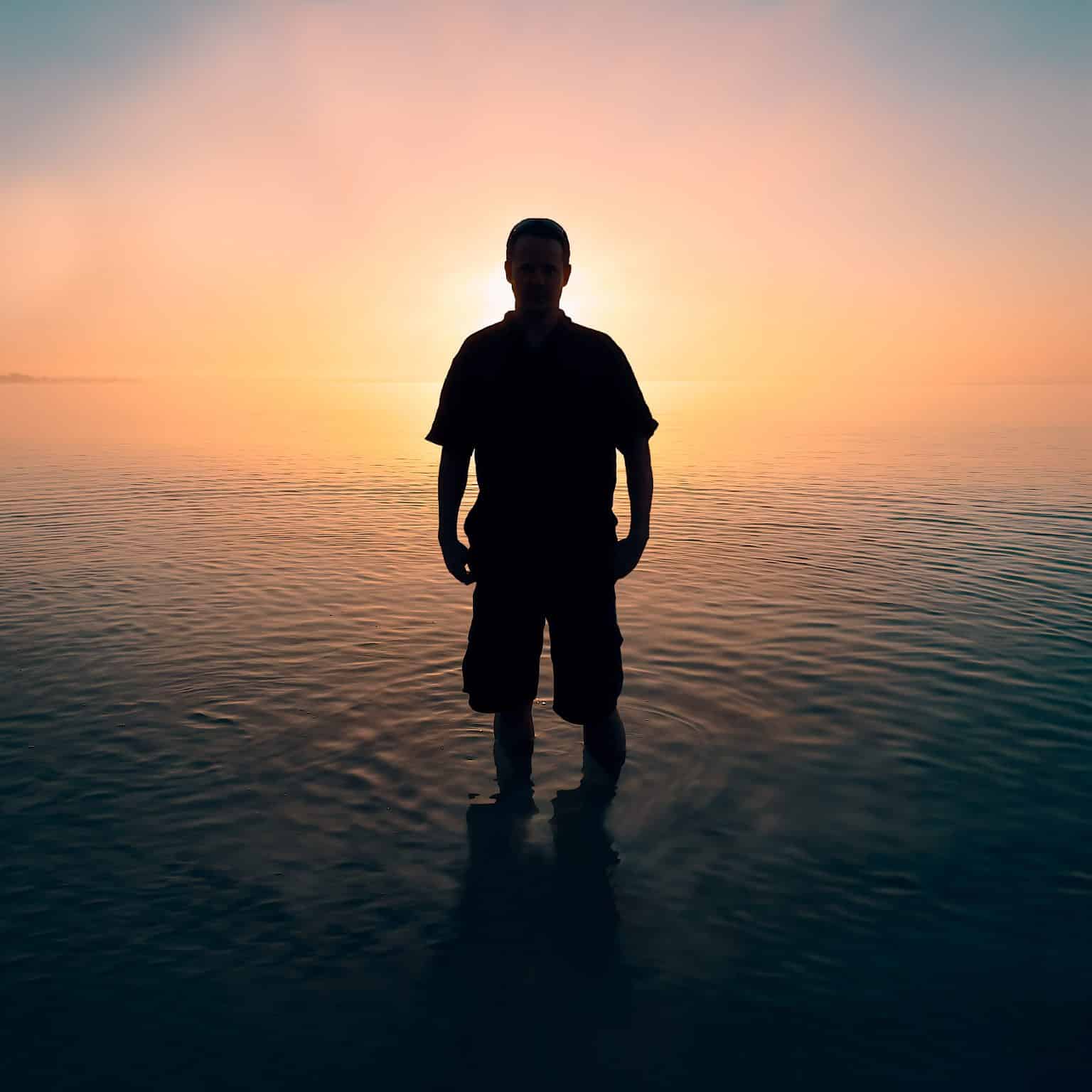 person standing still in water